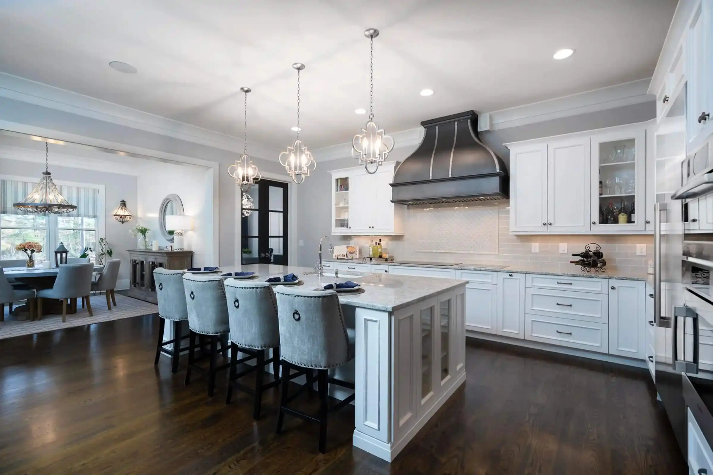 Spacious modern kitchen with island and dining area.