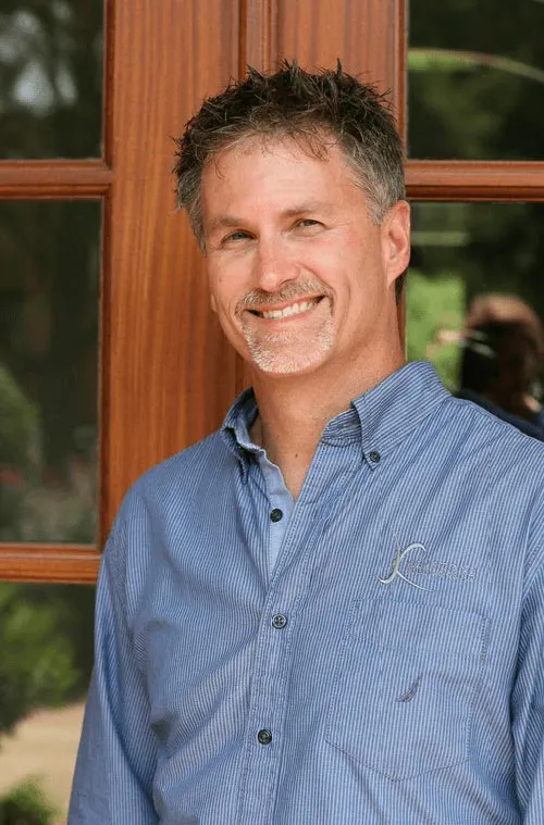 keystone-building-group-custom-homes-Artie-Smethers Smiling man in a blue shirt.