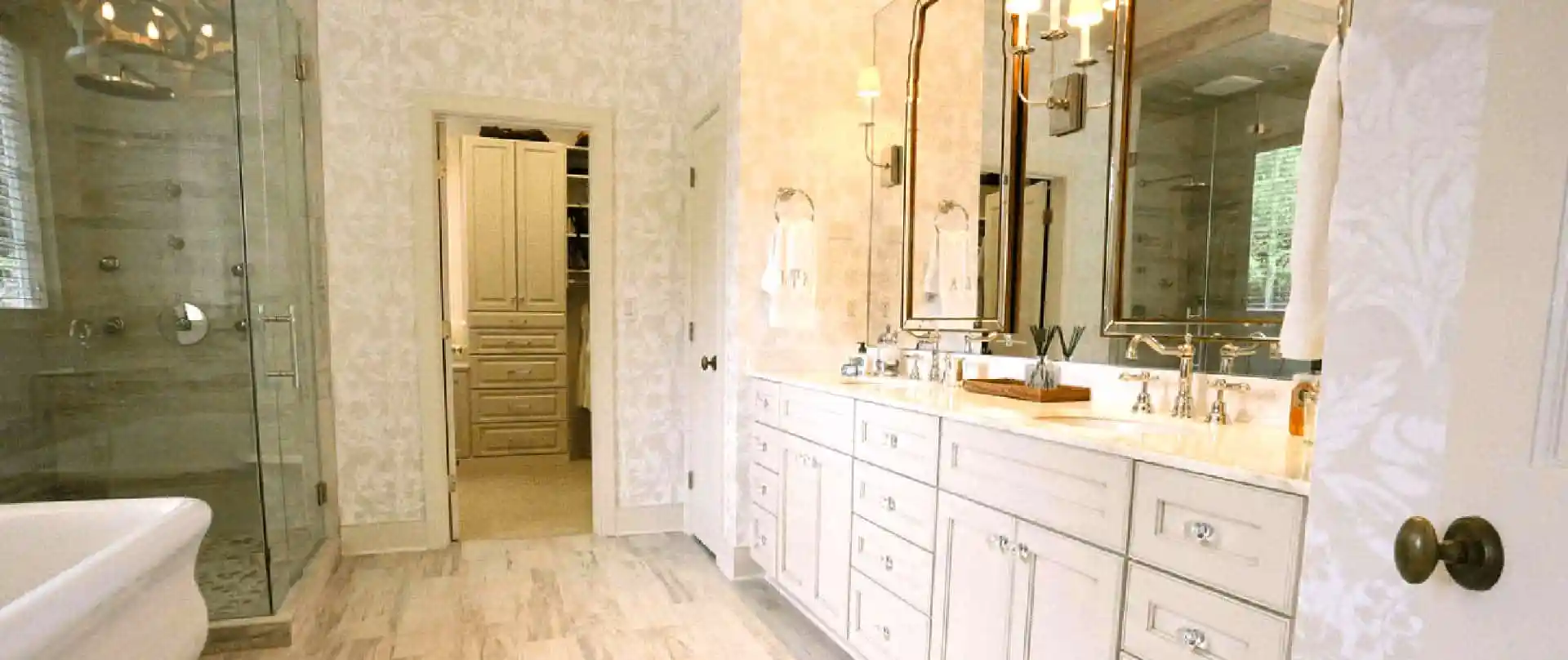 Elegant bathroom with double vanity and shower.